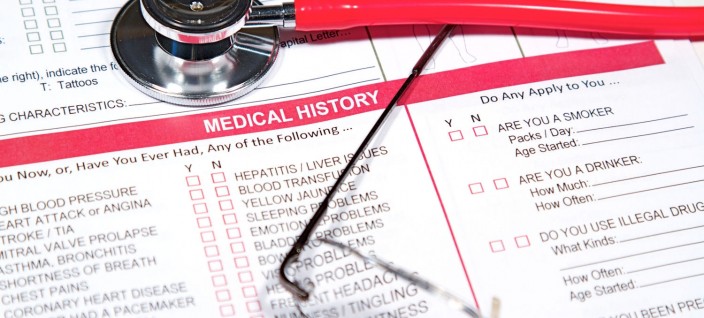 Close up of a Medical History form and a doctor's Stethoscope